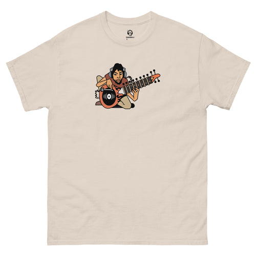 South Asian music t-short. Cream t-shirt with a graphic of a person playing a sitar with a turntable on a white background.
