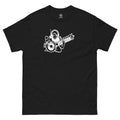 South Asian Underground streetwear. Black t-shirt with a white graphic of a person playing a sitar with a turntable on a black background.